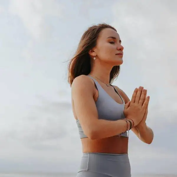 close up shot of a woman doing a yoga exercise during morning