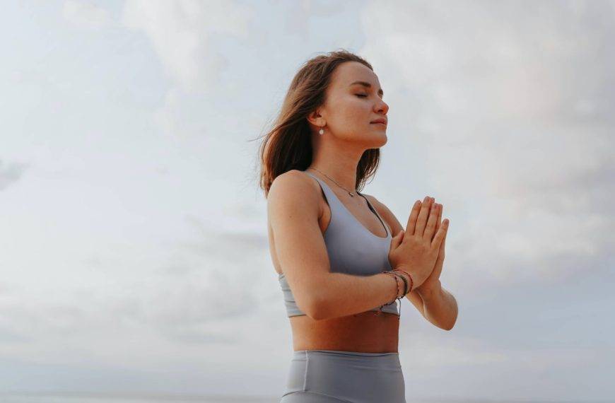 close up shot of a woman doing a yoga exercise during morning